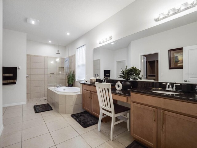 bathroom featuring vanity, a textured ceiling, tile patterned flooring, and shower with separate bathtub