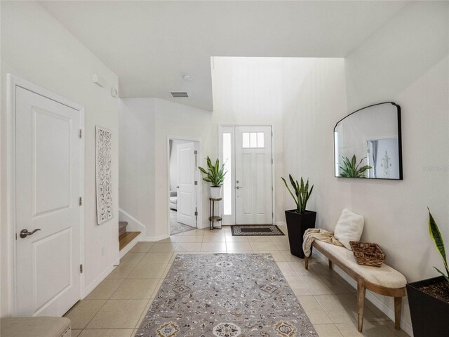 entryway featuring light tile patterned flooring