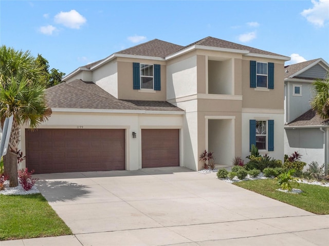 view of front of property featuring a shingled roof, concrete driveway, an attached garage, and stucco siding