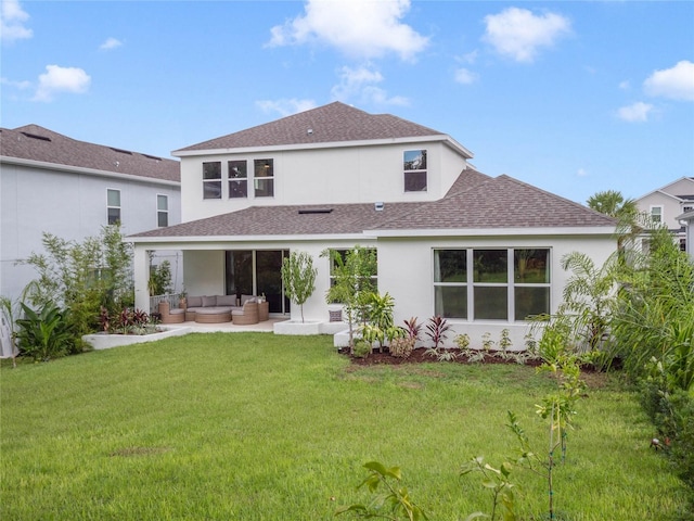 back of property featuring roof with shingles, stucco siding, a lawn, a patio area, and an outdoor living space