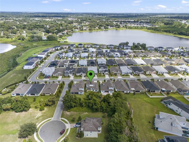 birds eye view of property with a water view and a residential view