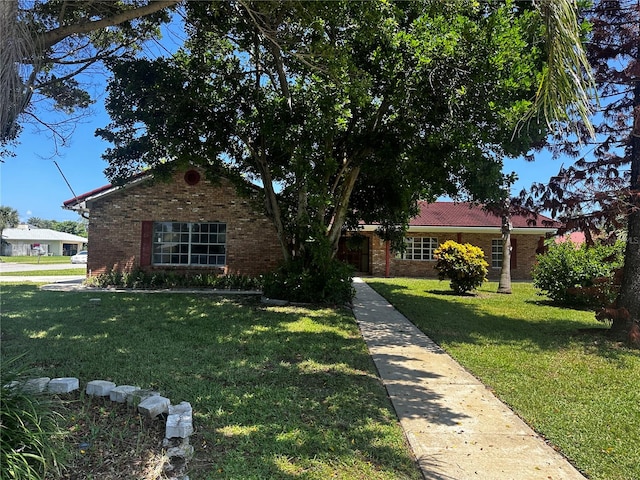 single story home featuring a front yard