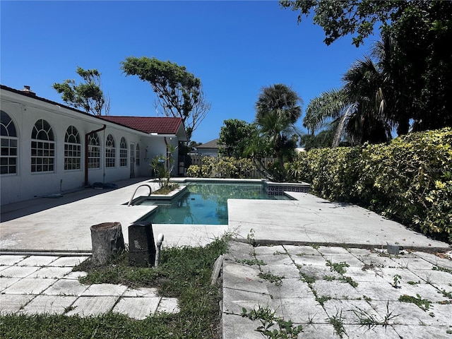 view of swimming pool featuring a patio