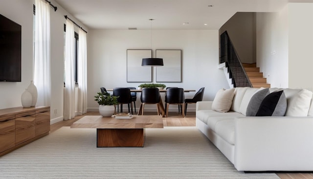 living room with light hardwood / wood-style flooring