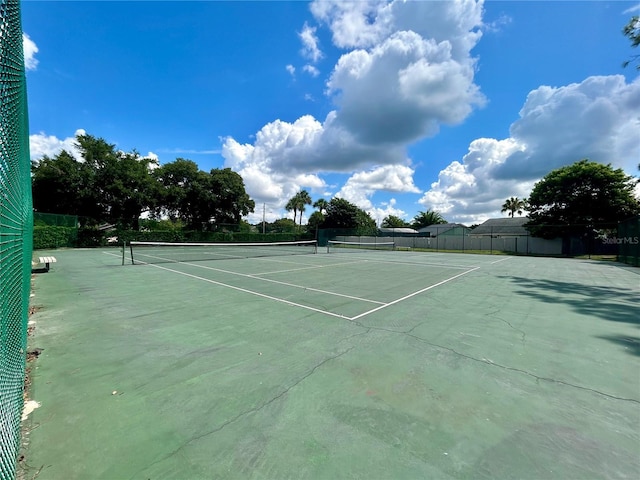 view of tennis court with fence