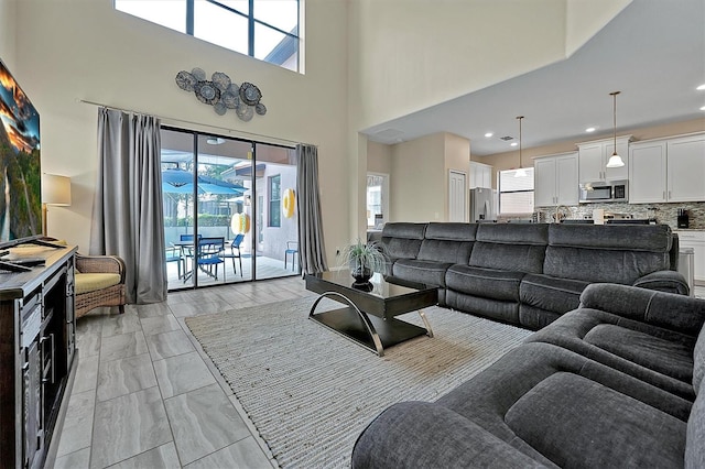 tiled living room featuring a wealth of natural light