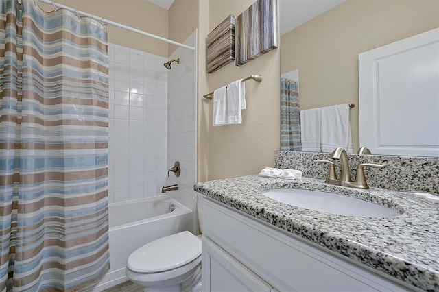 full bathroom featuring shower / bath combo, toilet, and vanity