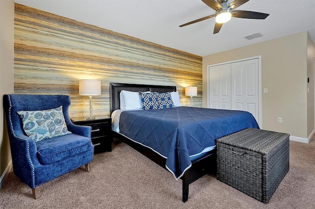 carpeted bedroom featuring a closet and ceiling fan