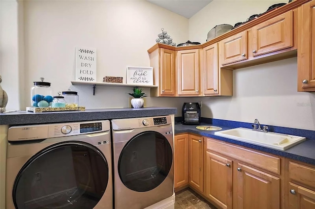 laundry room featuring sink, independent washer and dryer, and cabinets