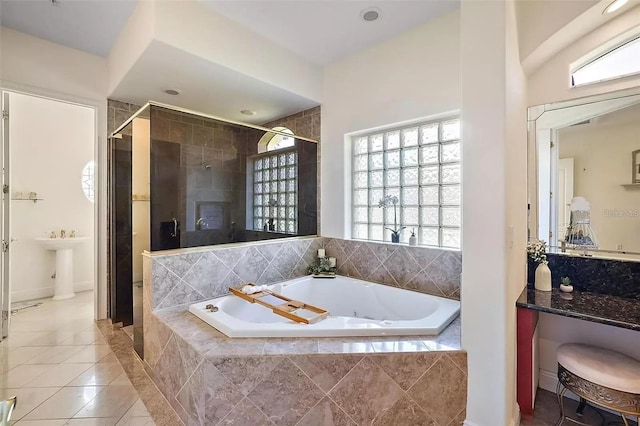 bathroom featuring independent shower and bath and tile patterned floors