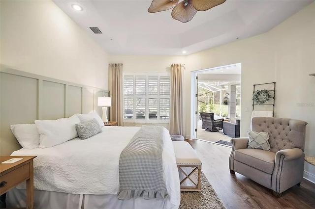 bedroom with access to exterior, dark hardwood / wood-style floors, and ceiling fan