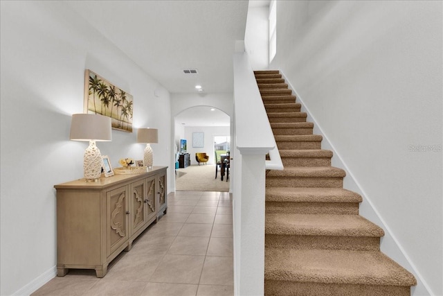 stairs featuring carpet floors