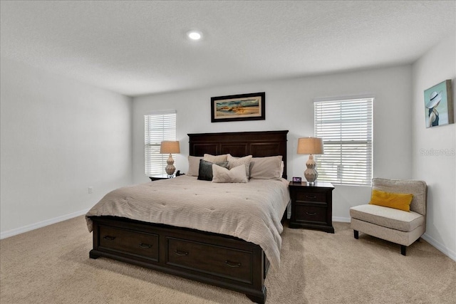 carpeted bedroom with a textured ceiling