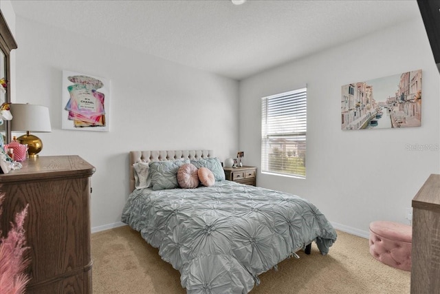 bedroom featuring light colored carpet