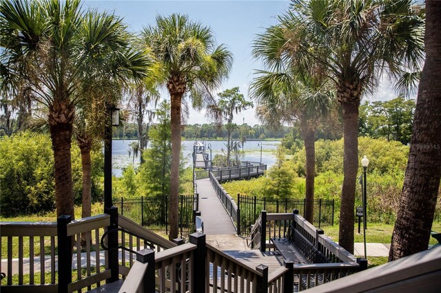 wooden terrace featuring a water view