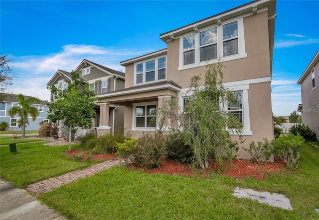 view of front of home with a front lawn