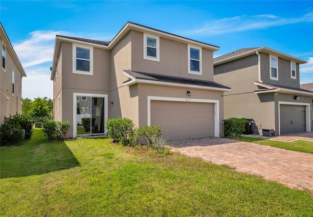 front of property featuring a garage and a front lawn