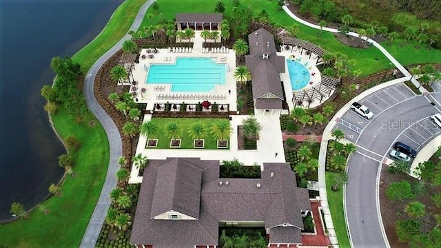 birds eye view of property with a water view