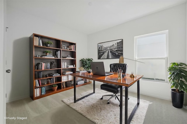 office area featuring light colored carpet