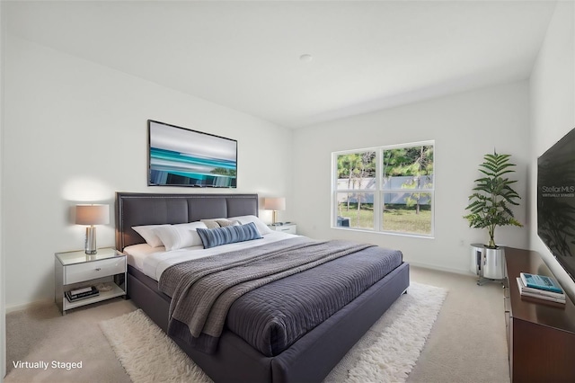 bedroom featuring light colored carpet