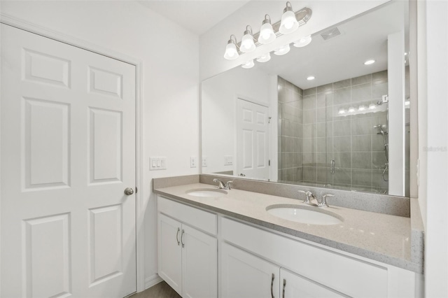 bathroom with vanity and an enclosed shower