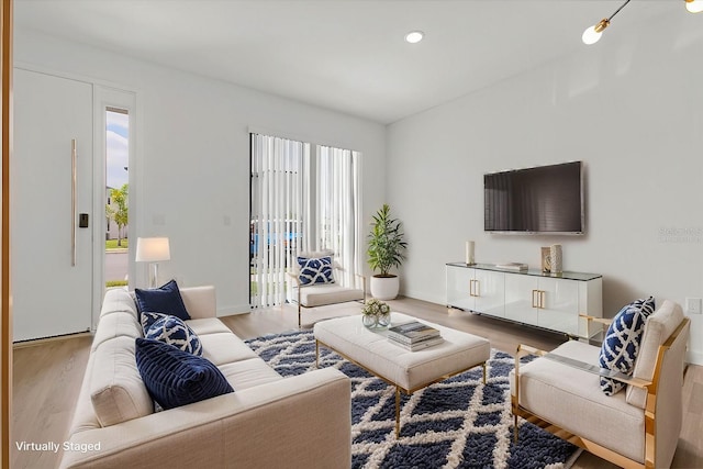 living area featuring recessed lighting and wood finished floors