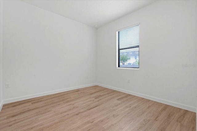 unfurnished room featuring light hardwood / wood-style flooring