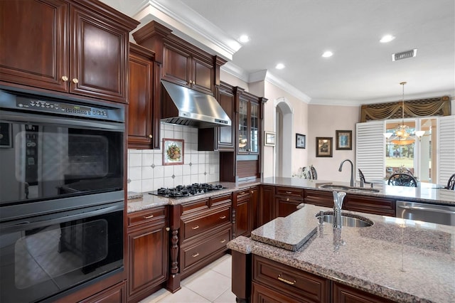 kitchen featuring backsplash, sink, a chandelier, stainless steel appliances, and pendant lighting