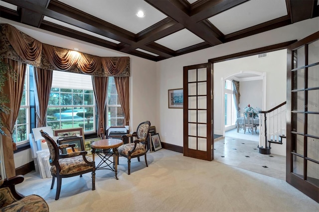 sitting room featuring light tile patterned floors, coffered ceiling, french doors, and beamed ceiling