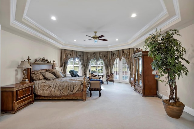 carpeted bedroom featuring ceiling fan, a raised ceiling, access to exterior, and crown molding