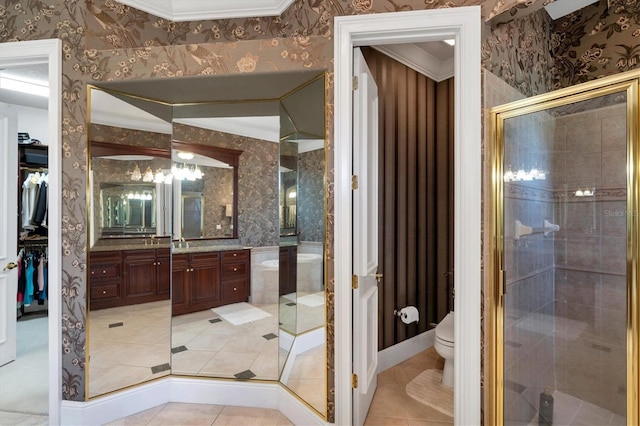 bathroom featuring tile patterned floors, toilet, an enclosed shower, and vanity