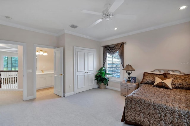 bedroom with ceiling fan, multiple windows, and light colored carpet