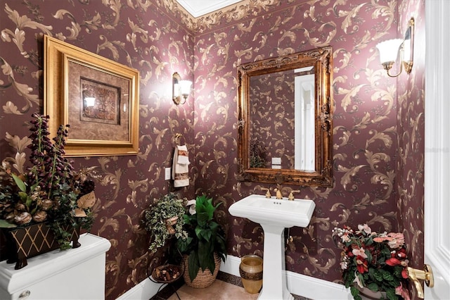 bathroom with toilet and tile patterned floors