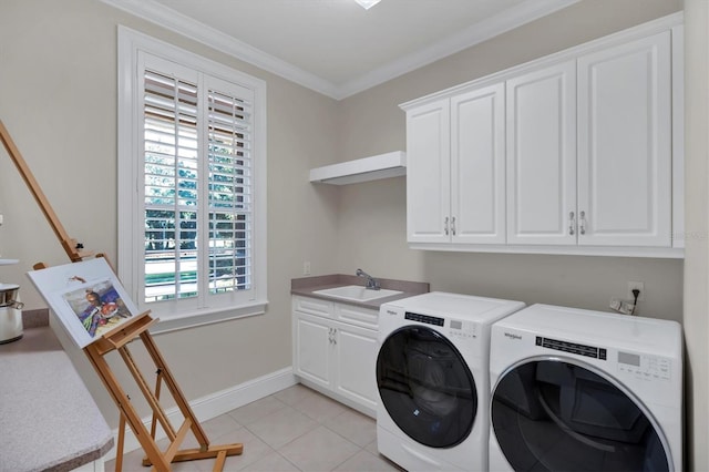 washroom with cabinets, ornamental molding, washing machine and dryer, light tile patterned floors, and sink