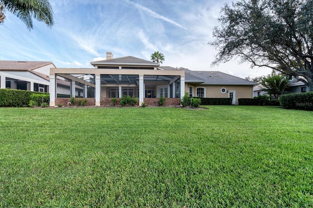 back of house with a yard