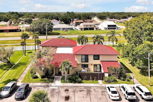 birds eye view of property with a residential view