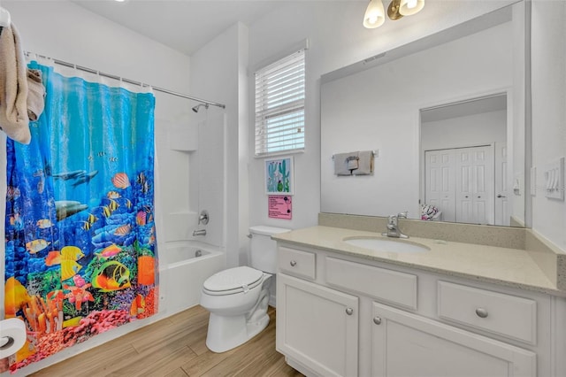 full bathroom featuring shower / bath combo with shower curtain, wood-type flooring, toilet, and vanity