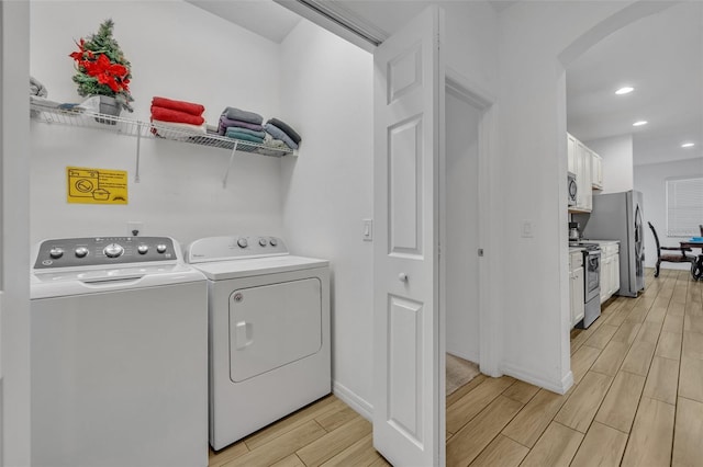 clothes washing area with washer and dryer