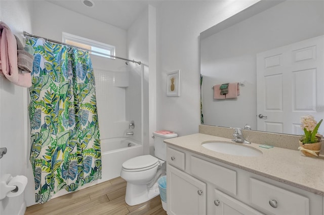 full bathroom featuring toilet, shower / tub combo, and vanity