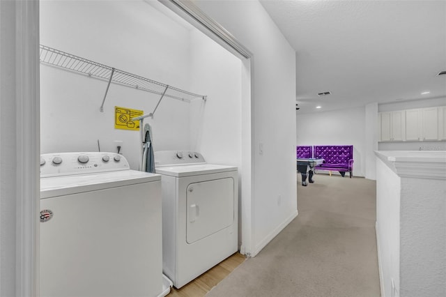 washroom featuring washing machine and clothes dryer