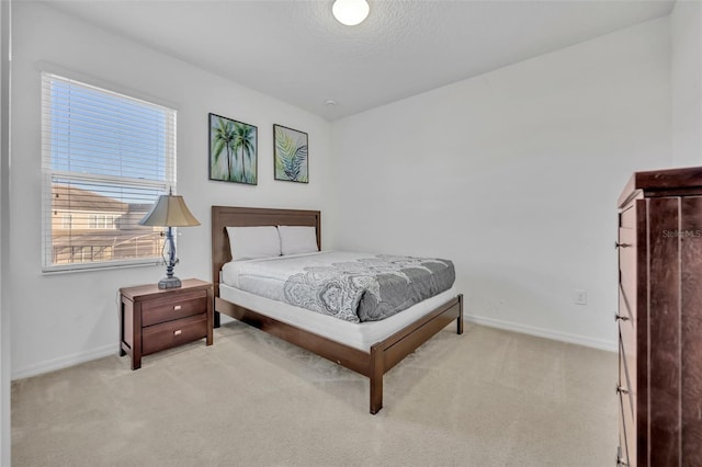 carpeted bedroom featuring a textured ceiling