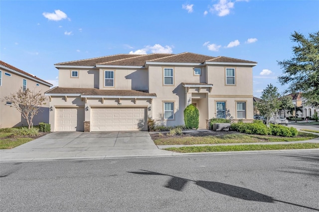 view of front of home with an attached garage, a residential view, concrete driveway, and stucco siding