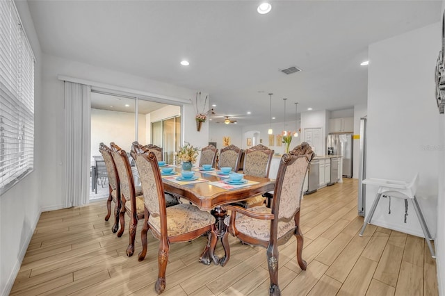 dining room featuring wood finish floors, visible vents, baseboards, and recessed lighting