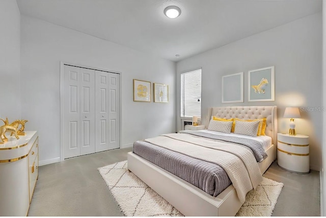 bedroom featuring a closet and baseboards