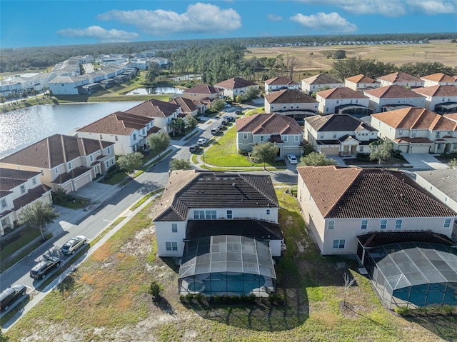 aerial view featuring a water view and a residential view