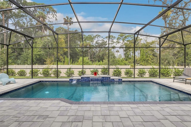 view of pool featuring a lanai, a patio, and pool water feature