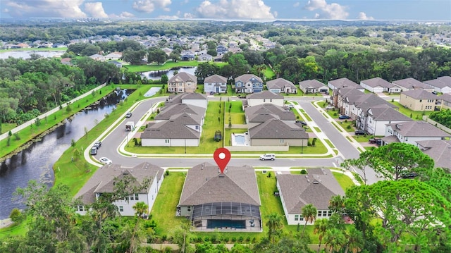 birds eye view of property featuring a water view