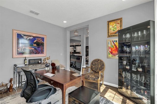 office area with hardwood / wood-style floors