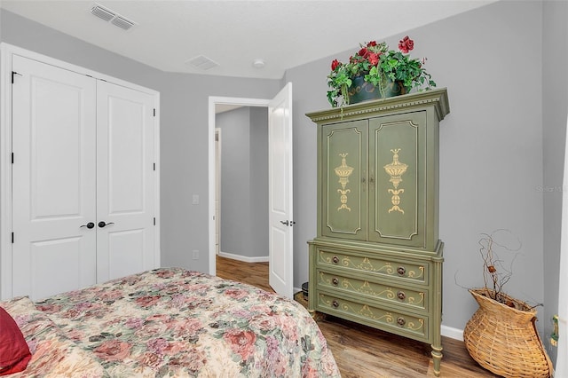 bedroom featuring a closet and wood-type flooring