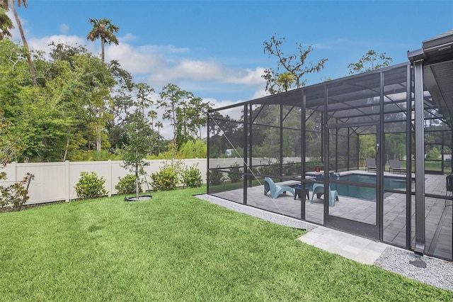 view of yard featuring a lanai, a fenced in pool, and a patio